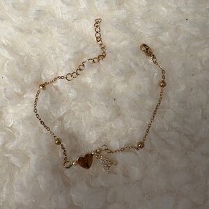 NWOT gold colored bracelet with heart and crystal letter A